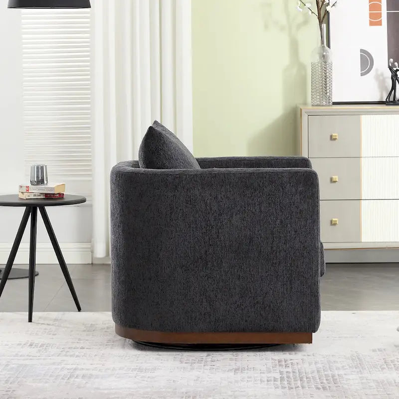 Le fauteuil baquet pivotant Chenille est doté d'une base métallique robuste et d'un design ergonomique.